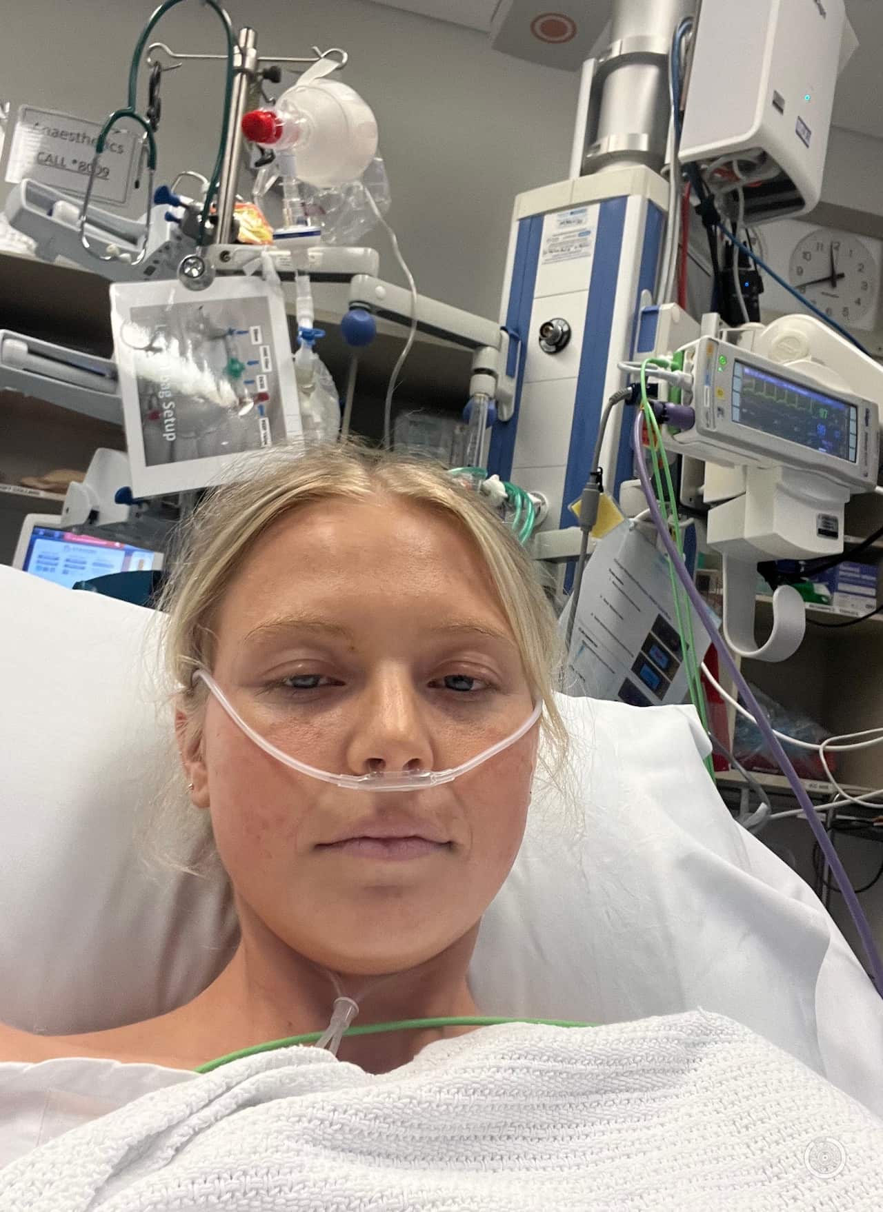 A young woman in a hospital bed with a 