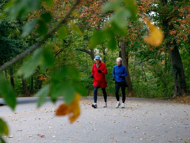 File photo of Kathleen Higgins and Jeff Klekner taking a brisk walk in Cherokee Park.