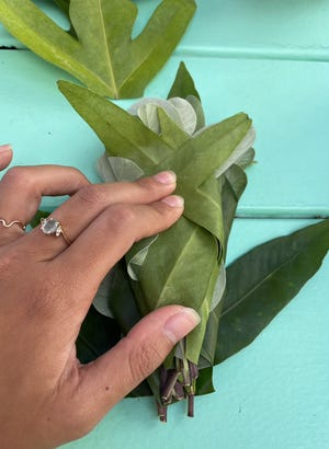 Lawson showed me how to fold leaves into a smudge stick.