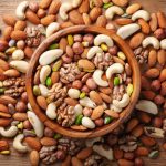 mixed nuts in a wooden bowl