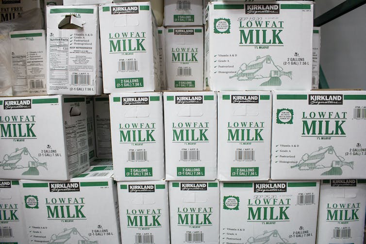 Pile of low fat milk in the supermarket