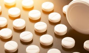 Adderall pills on a flat surface