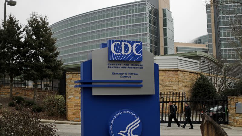 Pedestrians walk past the entrance to the US Centers for Disease Control and Prevention on the third day of the government shutdown in Atlanta on Monday, January 22, 2018. A CDC study shows the rate of depression in every U.S. state and county .