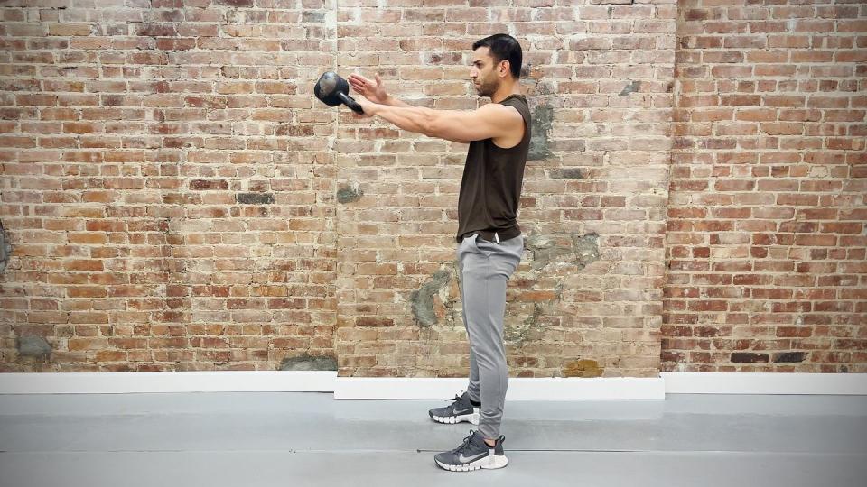 tamir practicing single arm swing exercise
