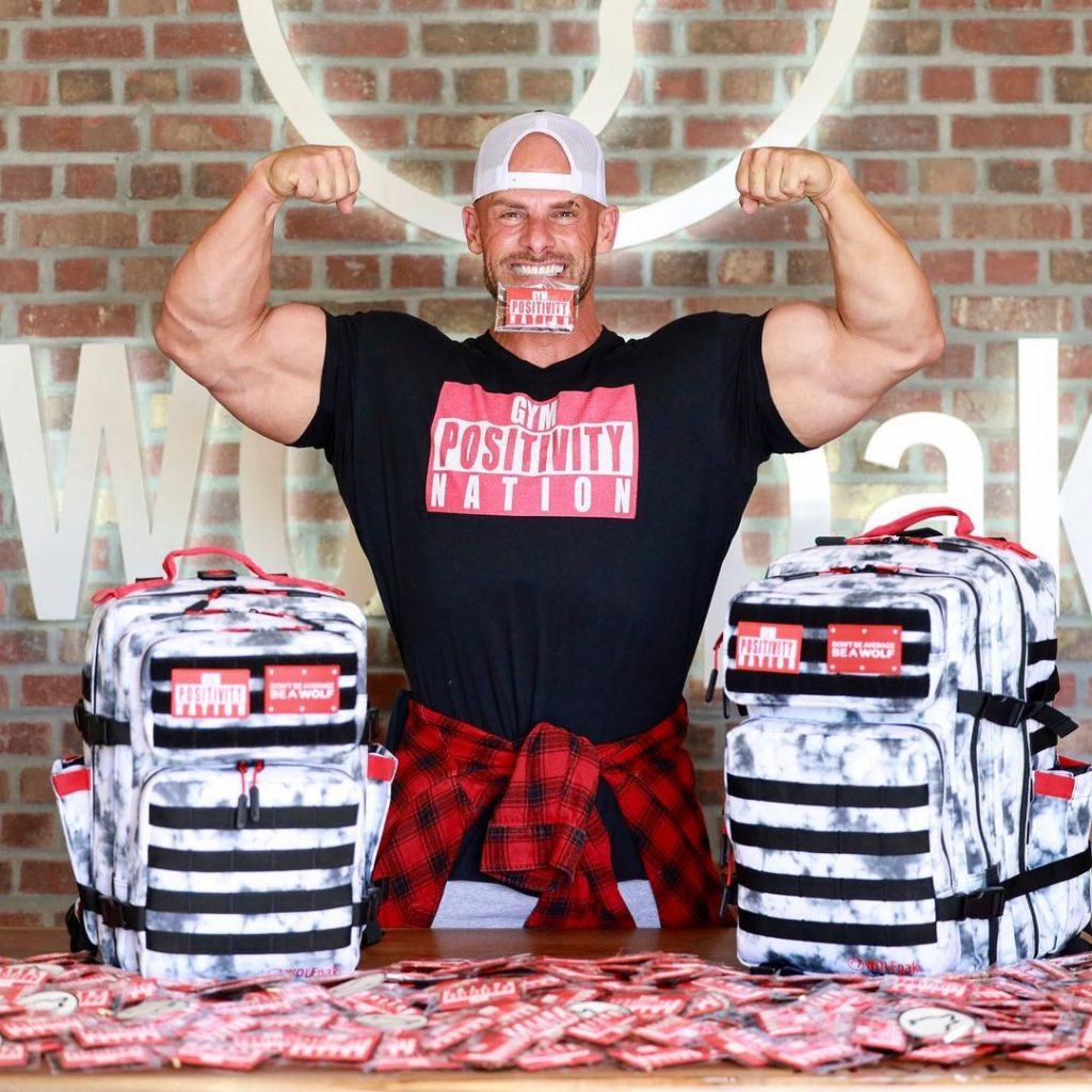 Joey Swoll flexing while promoting his merchandise.
